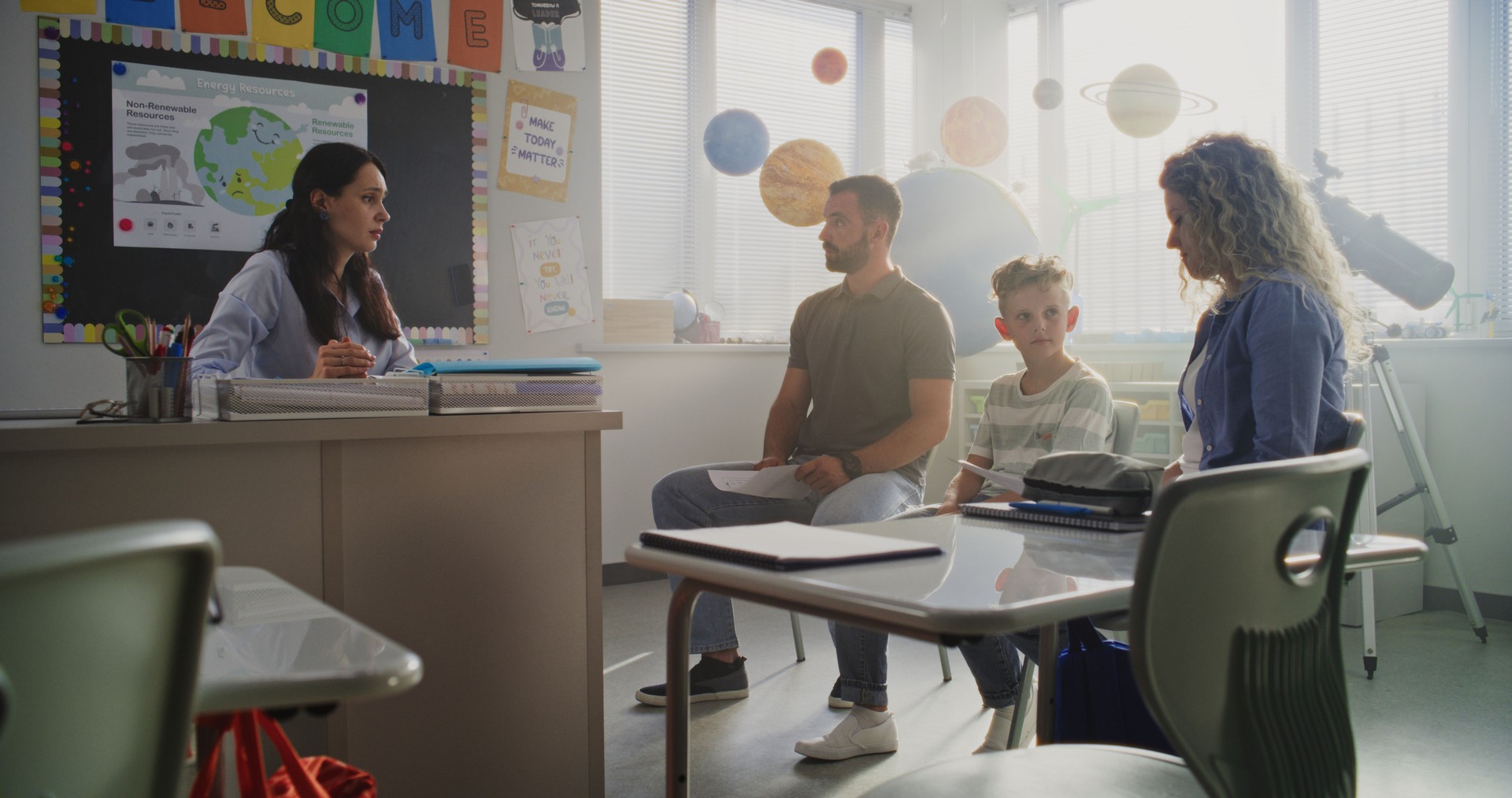Teacher and Parents Discussing Academic Failure of Primary School Student in Classroom